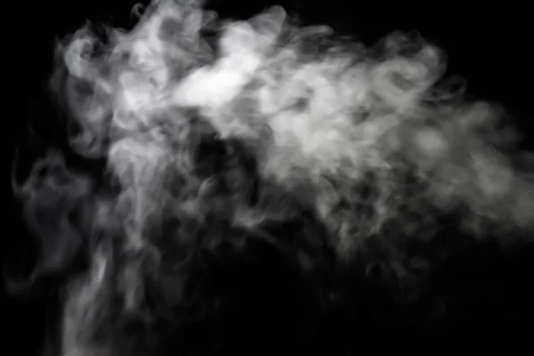 White smoke glow in the dark, Toxic smoke forms free shapes, Beautiful abstract abstraction on black background, used for background.