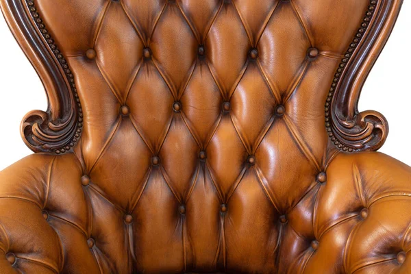 Detail of classic luxury brown leather armchair isolated on white background, beautiful modern design