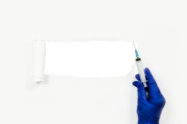 Hand Medical Blue Protective Glove Syringe White Background Torn Paper — Stock Photo, Image