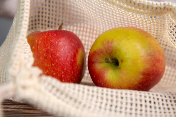 apples in an environmentally friendly bag, Eco friendly bag with red fresh apples with copy space, Fruit,Health,environment concept