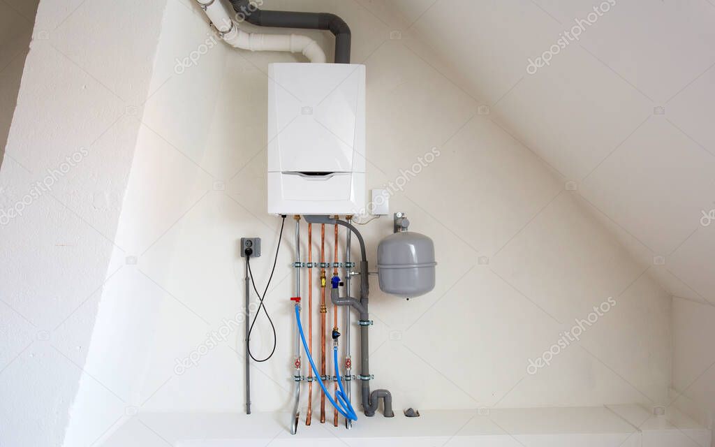 New gas boiler, Heating system with copper pipes, valves and other equipment in a boiler room gas heater system, modern in new house white wall