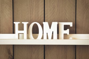 Ev iç mimarisi dekorasyonu Arka plan ahşap desenli yazı beyaz harfli ev yapımı kahverengi ahşap duvarlı modern tasarım elementi.