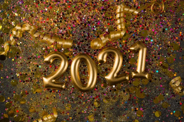 2021 New year greeting card, golden digits in sparkle background