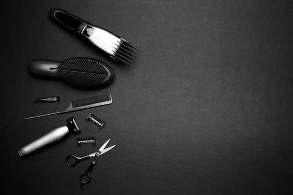 Equipment, tools for barber salon on black background
