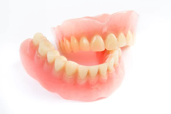 Sonrisa dental mandíbulas dientes sobre fondo blanco. Prótesis dental . —  Fotos de Stock