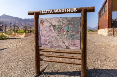 Hatta, UAE, 10.11.2020. Hatta Wadi Hub hiking and biking trails map with tourist information. clipart