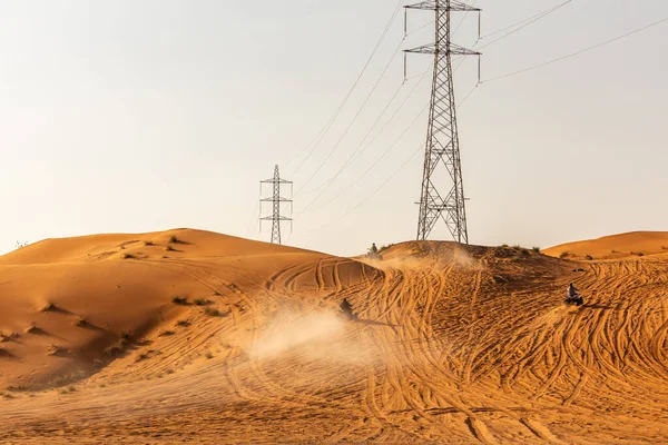Few Dune Buggies Driving Sand Dune Desert Electrical Towers Background — Stock Fotó