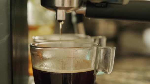 Coffee is poured from the coffee machine — Stock Video