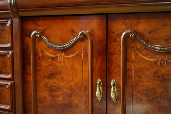 Wardrobe in the living room. The design of the mahogany.