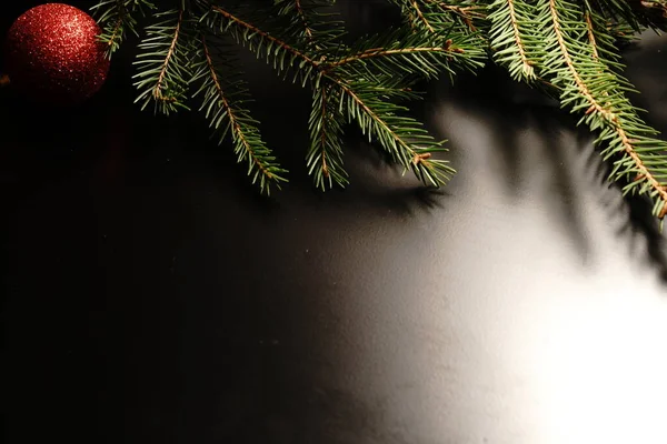 Christmas Tree Branch Black Background Close Dim Lights — Stock Photo, Image
