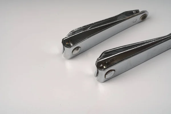 Two nail clippers folded on a white background. Imagen de archivo