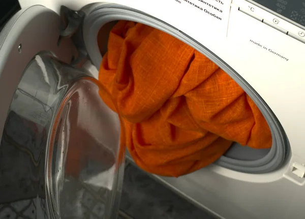 The open door of the washing machine from which the laundry sticks out. — Stock Photo, Image