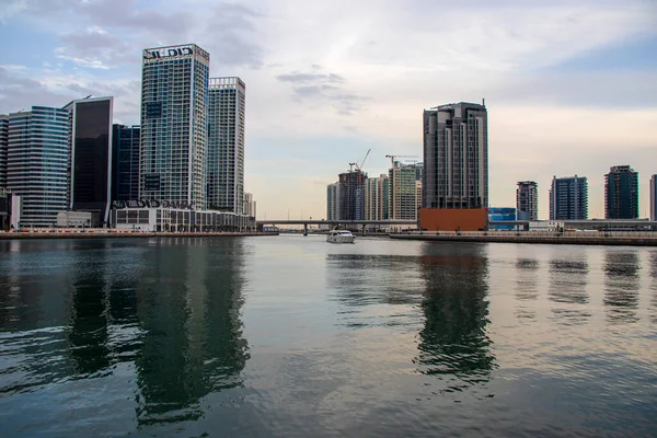 Modern buildings along the Dubai water canal, business bay district UAE. Outdoors