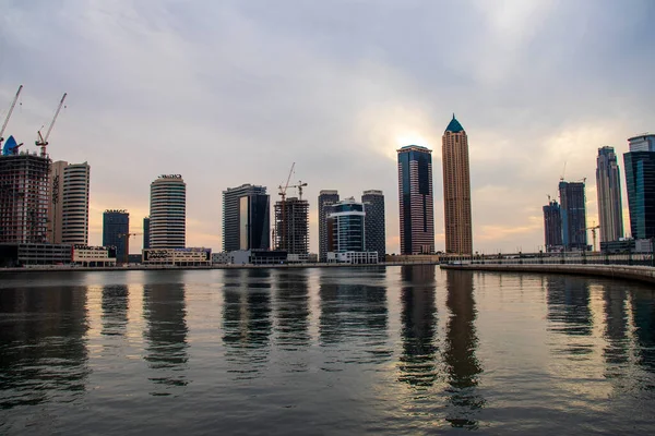 Modern buildings along the Dubai water canal, business bay district UAE. Outdoors