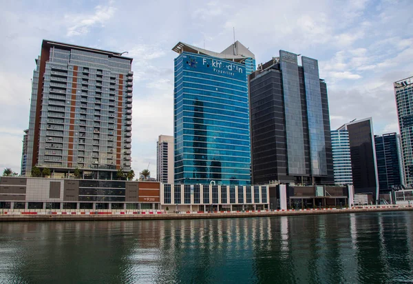 Modern buildings along the Dubai water canal, business bay district UAE. Outdoors