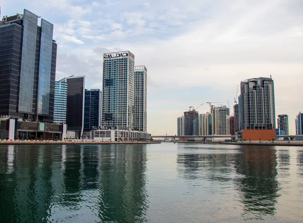 Modern buildings along the Dubai water canal, business bay district UAE. Outdoors