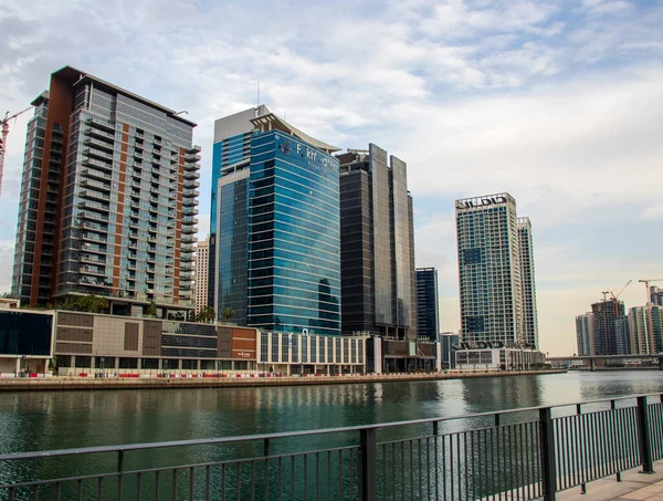 Modern buildings along the Dubai water canal, business bay district UAE. Outdoors