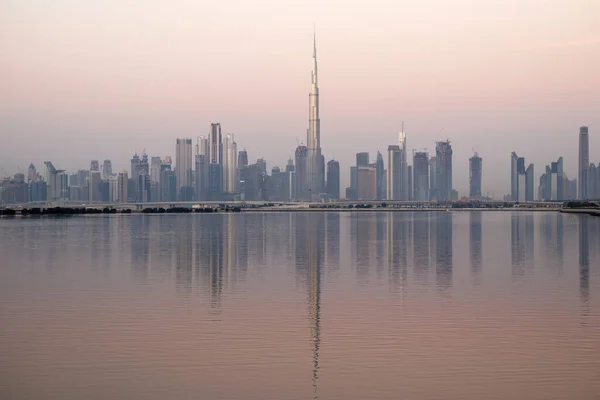 Dubai, UAE - 01.29.202 Sunrise over Dubai city skyline.