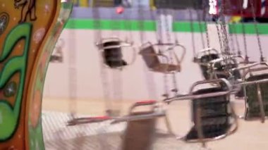 Footage of a rotating carousel ride. Attraction
