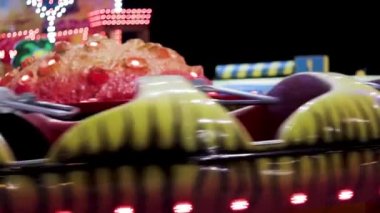Footage of a rotating carousel ride. Attraction