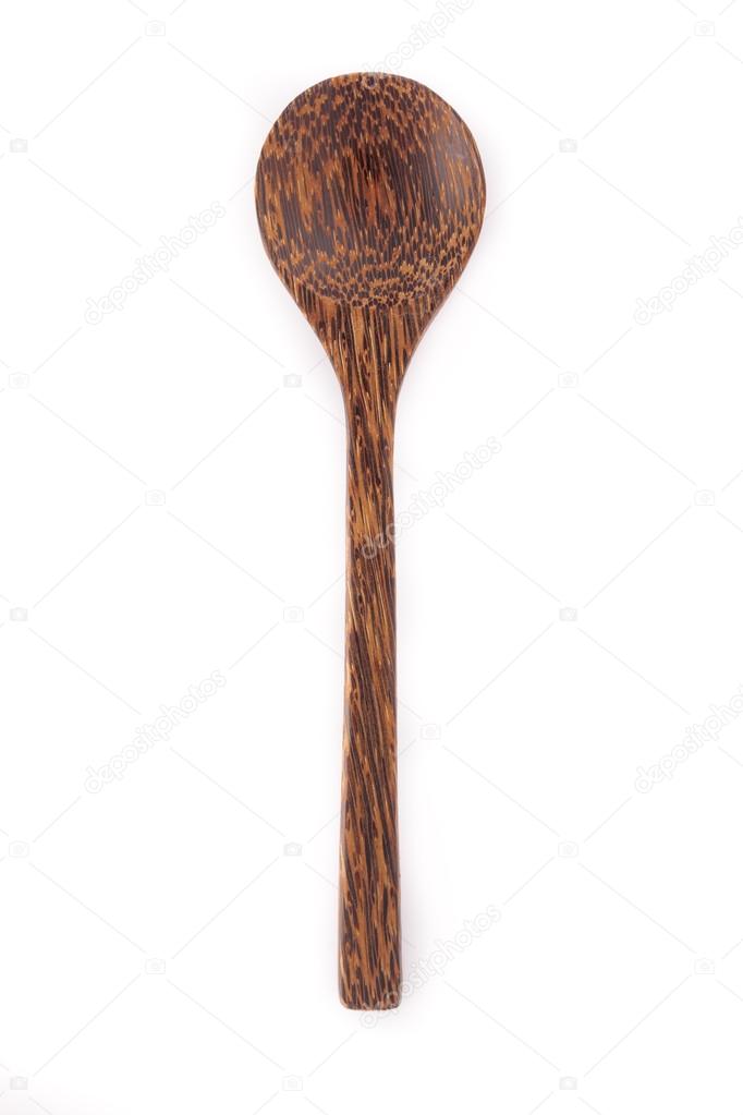 Close-up top view of wooden spoon isolated on white background.