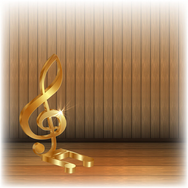 Golden treble clef on wooden background