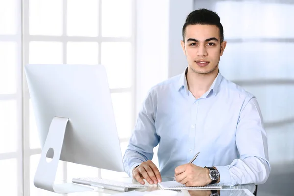 Businessman working with computer in modern office. Headshot of arab male entrepreneur or manager at workplace. Business concept — Stock Photo, Image