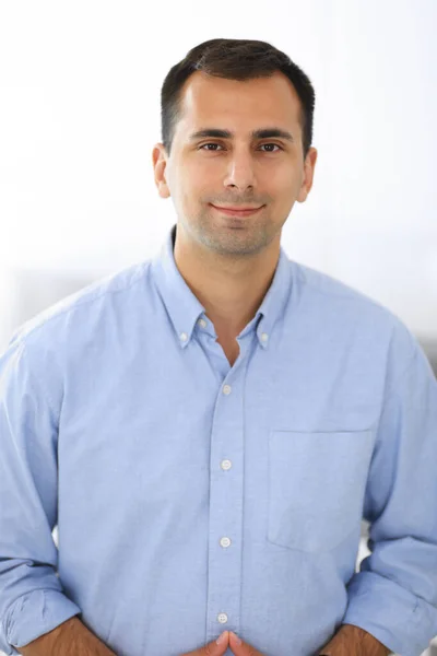 Businessman standing and looking at camera in office. Headshot of casual dressed adult guy happy smiling — Stock Photo, Image