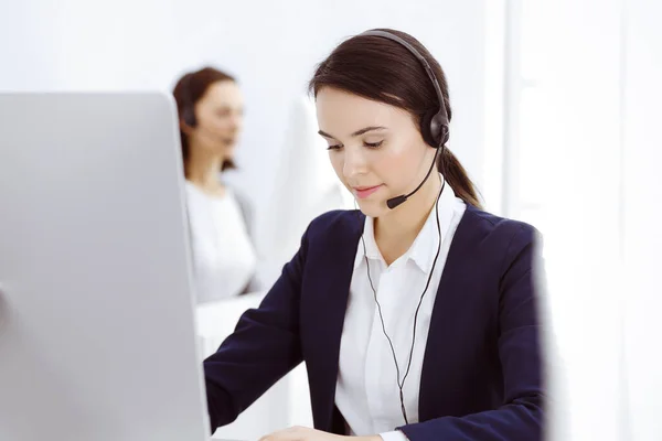 Call center. Beautiful woman sitting and working in headset at customer service office. Business concept — Stock Photo, Image