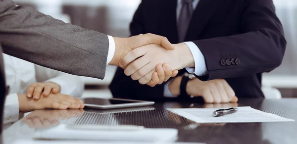 Handshake as successful negotiation ending, close-up. Unknown business people shaking hands after contract signing in modern office — Stock Photo, Image