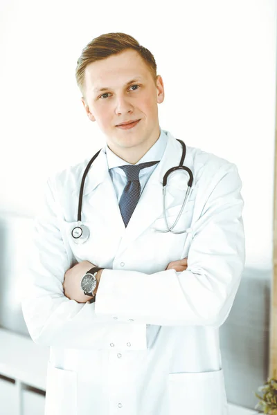 Doctor man standing straight in medical office or clinic. Medicine concept