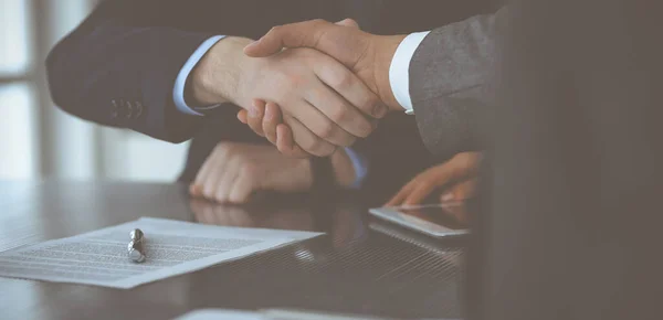Handshake as successful negotiation ending, close-up. Unknown business people shaking hands after contract signing in modern office — Stock Photo, Image