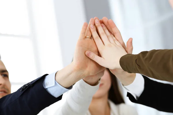 Business people group showing teamwork and joining hands or giving five in modern office. Unknown businessman and women making circle with their hands — Stock Photo, Image