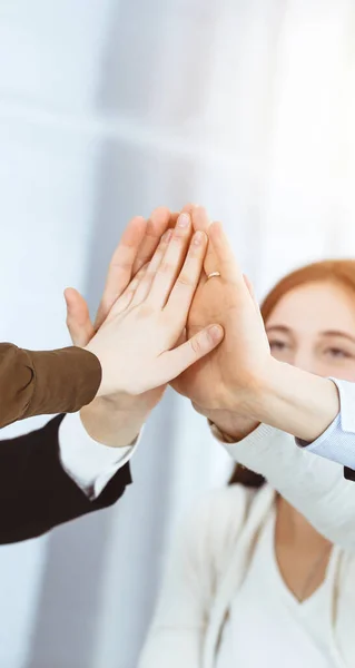 Business people group showing teamwork and joining hands or giving five in sunny office. Unknown businessman and women making circle with their hands — Stock Photo, Image