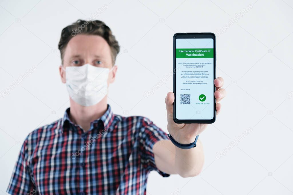 Men Showing Certificate of Vaccination on a Mobile Phone