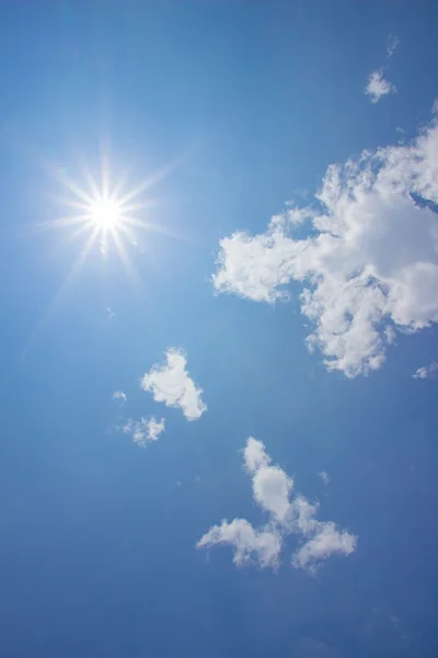 Blue sky with sun and clouds — Stock Photo, Image