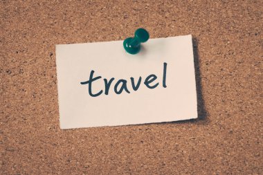 travel note pinned on the bulletin board