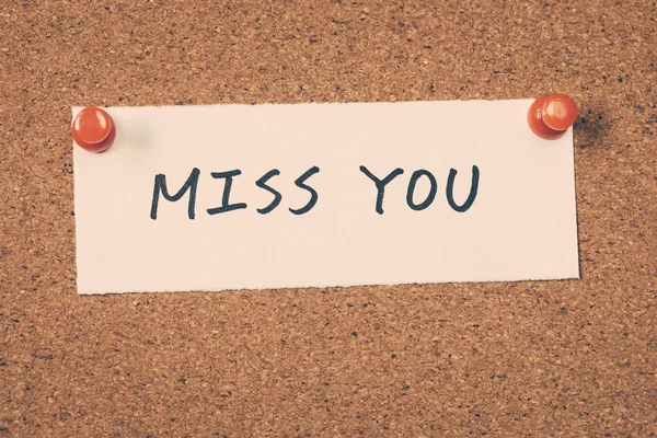 Miss you note pinned on the buletin board — Stok Foto