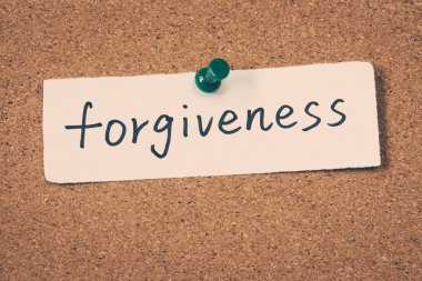 forgiveness note pinned on the bulletin board