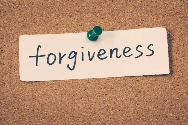 forgiveness note pinned on the bulletin board