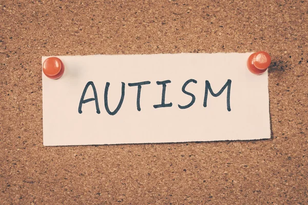 Autism note pinned on the bulletin board Royalty Free Stock Photos