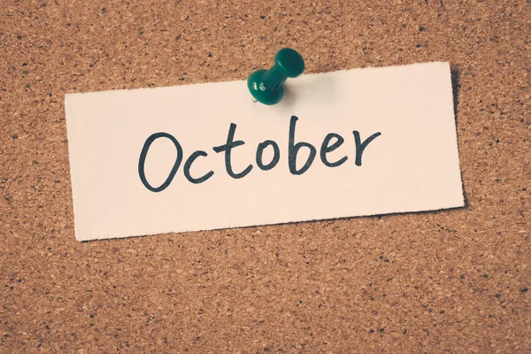 October note pinned on the bulletin board — Stock Photo, Image