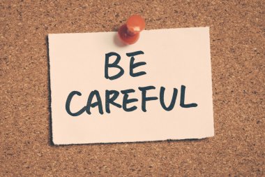 be careful note pinned on the bulletin board clipart