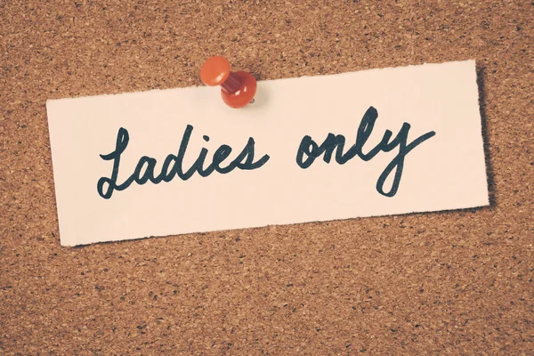 Ladies only note pinned on the bulletin board — Stock Photo, Image