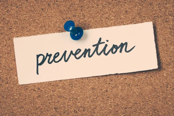 Prevention note pinned on the bulletin board — Stock Photo, Image