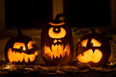 Photo of three pumpkins for Halloween. clipart