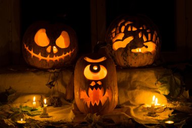Photo composition from three pumpkins on Halloween. clipart