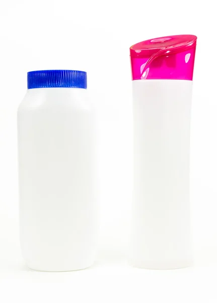 White plastic bottles on isolated white background — Stock Photo, Image