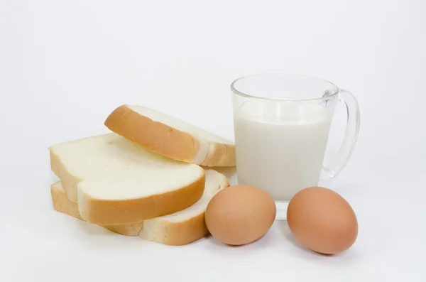 Slices of bread isolated  eggs and milk on white background — Stock Photo, Image
