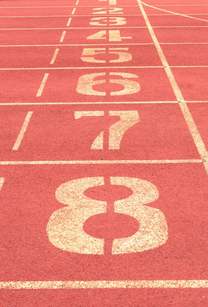 Número en pista de atletismo fondo vintage — Foto de Stock